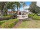 View of the Windsor Hills clubhouse sign with lush landscaping and palm trees at 7663 Fitzclarence St, Kissimmee, FL 34747