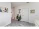 View of entryway with updated flooring and modern decor at 7663 Fitzclarence St, Kissimmee, FL 34747
