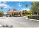 Community entrance with a gatehouse, lush landscaping, and a secure gated entry at 7663 Fitzclarence St, Kissimmee, FL 34747