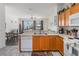 Well-lit kitchen with ample counter space and appliances provides functionality and style for cooking and entertaining at 7663 Fitzclarence St, Kissimmee, FL 34747