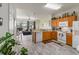 Bright kitchen with updated cabinets and appliances, open to the living area, providing style and convenience at 7663 Fitzclarence St, Kissimmee, FL 34747