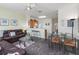 Open-concept living and dining area, with kitchen access, offers a seamless flow for entertaining and comfortable living at 7663 Fitzclarence St, Kissimmee, FL 34747