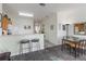 Open living space with eat-in kitchen and breakfast bar offers a harmonious blend of style and functionality at 7663 Fitzclarence St, Kissimmee, FL 34747