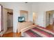 Bedroom with wood flooring, closet and bathroom access at 7663 Fitzclarence St, Kissimmee, FL 34747