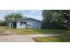 A cozy home featuring tidy landscaping, a paved walkway, and a well-maintained lawn at 767 Willie Mays Pkwy, Orlando, FL 32811