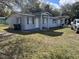 Cozy single-story home with a front porch, a compact yard, and off-street parking at 767 Willie Mays Pkwy, Orlando, FL 32811