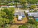 Aerial view of a charming home featuring a screened in patio and fenced backyard at 808 Malone Dr, Orlando, FL 32810