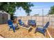 Cozy backyard setup with a fire pit and Adirondack chairs creates a welcoming space for outdoor gatherings at 808 Malone Dr, Orlando, FL 32810