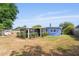 This home features a screened in porch with a spacious backyard area at 808 Malone Dr, Orlando, FL 32810