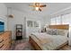 Comfortable bedroom showcases a wooden bed frame, stylish rug, and soft, natural lighting for a relaxing ambiance at 808 Malone Dr, Orlando, FL 32810