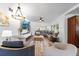 Spacious living room featuring contemporary furniture, stylish decor, and hardwood floors at 808 Malone Dr, Orlando, FL 32810