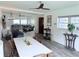 Bright living room with an open layout, ceiling fans, and grey wood-look flooring at 808 Malone Dr, Orlando, FL 32810