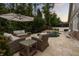Relaxing backyard oasis featuring a kidney-shaped pool, stone waterfall, and comfortable wicker lounge furniture at 9534 Piccadilly Sky Way, Orlando, FL 32827