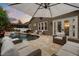 Inviting backyard with pool, waterfall feature, and outdoor seating area perfect for relaxing and entertaining at 9534 Piccadilly Sky Way, Orlando, FL 32827