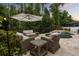 Relaxing backyard oasis featuring a kidney-shaped pool, stone waterfall, and comfortable wicker lounge furniture at 9534 Piccadilly Sky Way, Orlando, FL 32827