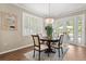 Dining room with natural lighting from the adjacent patio and a chandelier at 9534 Piccadilly Sky Way, Orlando, FL 32827