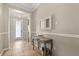 The foyer features neutral decor, a decorative table, and tile flooring at 9534 Piccadilly Sky Way, Orlando, FL 32827