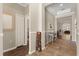 Inviting hallway with tiled floors, neutral paint, and views to other rooms at 9534 Piccadilly Sky Way, Orlando, FL 32827