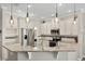 Bright kitchen featuring stainless appliances, white cabinets, and granite countertops at 9534 Piccadilly Sky Way, Orlando, FL 32827