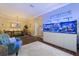 Open-concept living space includes a dining area and aquarium, creating a unique ambiance at 9534 Piccadilly Sky Way, Orlando, FL 32827