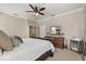 Spacious main bedroom with a large bed, dark wood furniture, and a neutral color palette at 9534 Piccadilly Sky Way, Orlando, FL 32827
