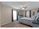 Comfortable bedroom with large windows, and a ceiling fan at 1022 Pinehurst Ct, Oviedo, FL 32765