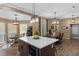 Spacious kitchen island with bar seating, integrated appliances, and an adjacent dining area at 1022 Pinehurst Ct, Oviedo, FL 32765