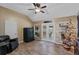 Cozy living room featuring wood-look floors, neutral paint, and a ceiling fan at 1022 Pinehurst Ct, Oviedo, FL 32765