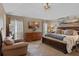 Spacious main bedroom with a decorative accent wall and an abundance of natural light at 1022 Pinehurst Ct, Oviedo, FL 32765