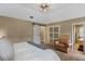 Bright bedroom featuring a sliding barn door leading to the attached bath at 1022 Pinehurst Ct, Oviedo, FL 32765