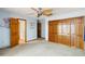 Bright bedroom featuring double closets, ceiling fan, and easy access to bath at 1093 Hidden Harbor Ln, Kissimmee, FL 34746