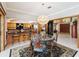 Open dining area with decorative chandelier and kitchen view at 1093 Hidden Harbor Ln, Kissimmee, FL 34746