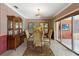 Elegant dining room with wooden floors and sliding glass doors to the outside at 1093 Hidden Harbor Ln, Kissimmee, FL 34746