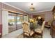 Dining room with sliding doors to the outside pool, perfect for indoor/outdoor dining at 1093 Hidden Harbor Ln, Kissimmee, FL 34746