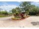 Welcoming entrance to Hidden Harbor featuring well-maintained landscaping and brick detailing at 1093 Hidden Harbor Ln, Kissimmee, FL 34746