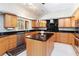 Bright kitchen boasting stainless steel appliances, stylish cabinetry, and granite countertops at 1093 Hidden Harbor Ln, Kissimmee, FL 34746