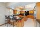 Spacious kitchen featuring granite countertops, stainless steel appliances, and a functional center island at 1093 Hidden Harbor Ln, Kissimmee, FL 34746