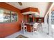 Outdoor kitchen and bar with stools for entertaining at 1093 Hidden Harbor Ln, Kissimmee, FL 34746
