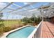 Enclosed pool with clear view of the adjacent yard and landscaping at 1093 Hidden Harbor Ln, Kissimmee, FL 34746