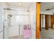 Shower with sliding glass doors, and tile surround, plus access to wardrobe and bathroom at 1093 Hidden Harbor Ln, Kissimmee, FL 34746