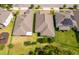 Aerial view of home with well-kept yard, trees, and neighboring homes at 11054 Cyrilla Woods Dr, Orlando, FL 32832