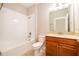 Bathroom with tub and shower combination, and vanity with lots of storage at 11054 Cyrilla Woods Dr, Orlando, FL 32832