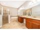 Spacious bathroom boasts double vanity, separate shower and tub, with a neutral color palette at 11054 Cyrilla Woods Dr, Orlando, FL 32832