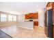 Open kitchen includes stainless appliances, an island with countertop seating, and natural light at 11054 Cyrilla Woods Dr, Orlando, FL 32832