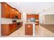 Well-lit kitchen boasts stainless steel appliances, granite countertops, and tiled flooring throughout at 11054 Cyrilla Woods Dr, Orlando, FL 32832