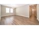 The living room is open and bright with hardwood floors and modern lighting at 11054 Cyrilla Woods Dr, Orlando, FL 32832