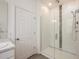 Modern bathroom with a glass-enclosed shower featuring elegant tile accents, complemented by a sleek vanity and fixtures at 1167 Celery Oaks Ln, Sanford, FL 32771