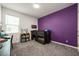 Bedroom featuring purple accent wall, lofted twin bed, and gray carpeting at 1167 Celery Oaks Ln, Sanford, FL 32771