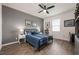 Stylish bedroom featuring a blue-themed bed, neutral-toned walls, and contemporary decor, creating a calming atmosphere at 1167 Celery Oaks Ln, Sanford, FL 32771
