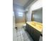 Bathroom with ceramic tile, shower-tub combo and vanity at 12112 Shallot St, Orlando, FL 32837